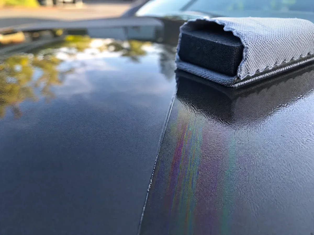 CeramicX coating being applied by hand — Scarabbodyworks Detailing in Austin, TX