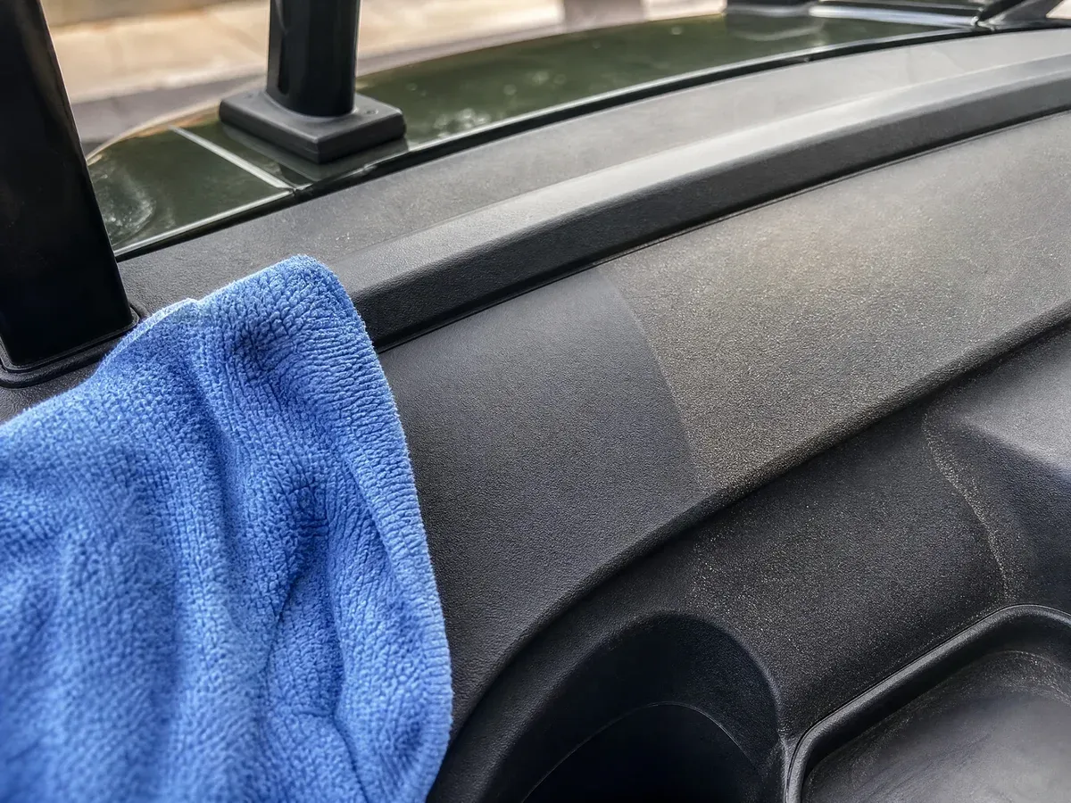 Detailer cleaning golf cart seats